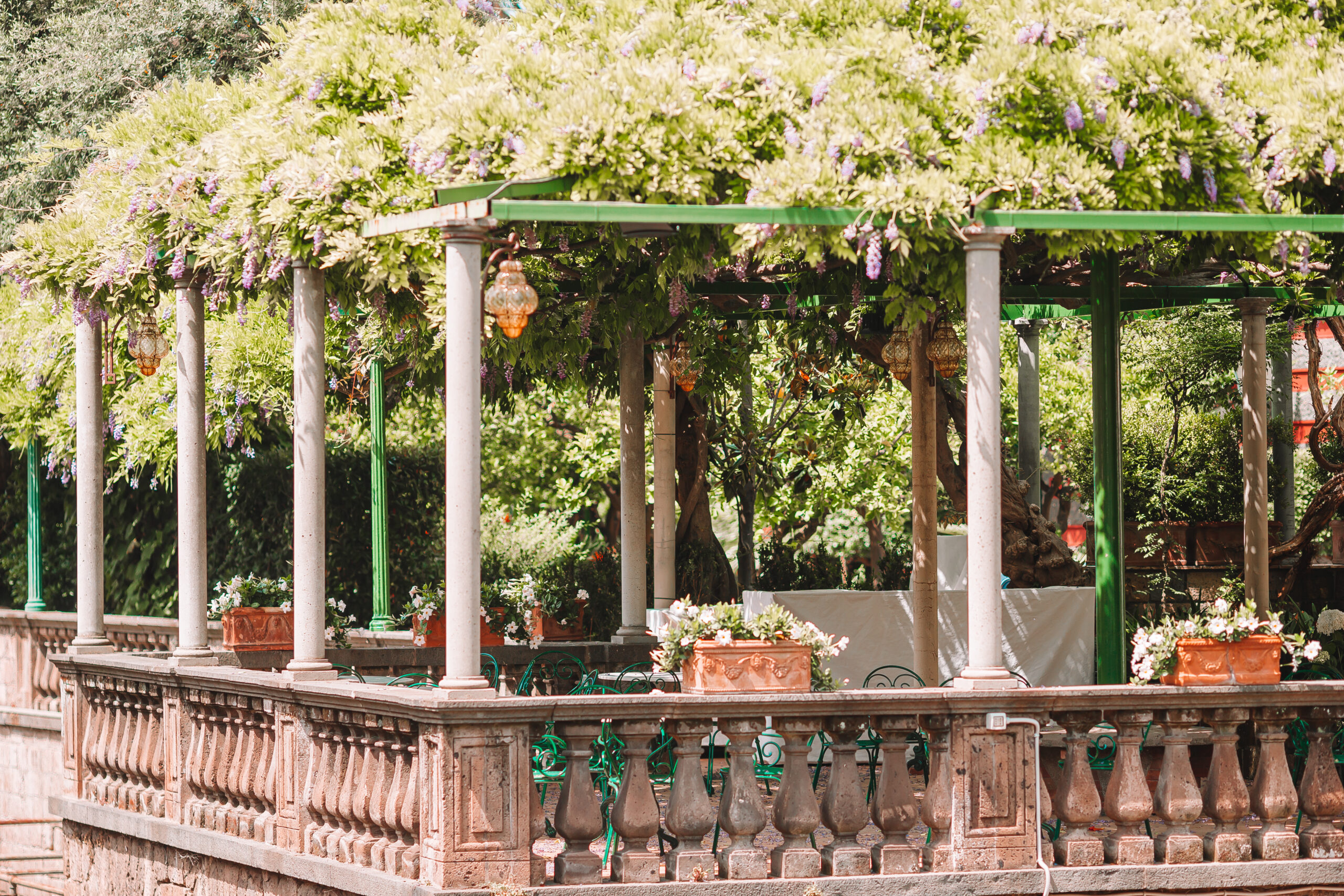 Summer empty outdoor cafe at old tourist european city in Italy
